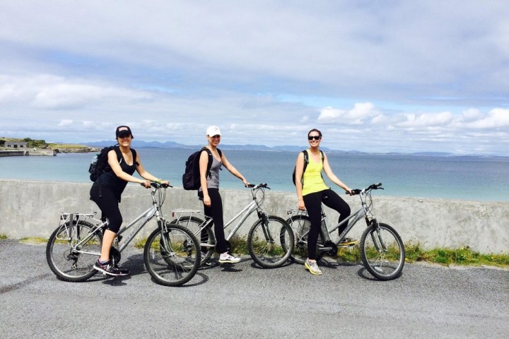a bicycle is parked next to a body of water