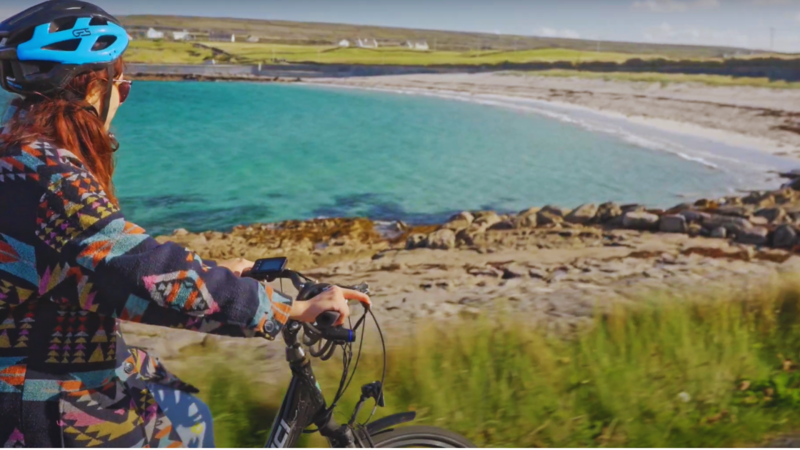 a person standing next to a body of water