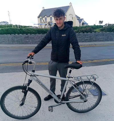 download – 2025-04-16T012700.829 a man riding on the back of a bicycle