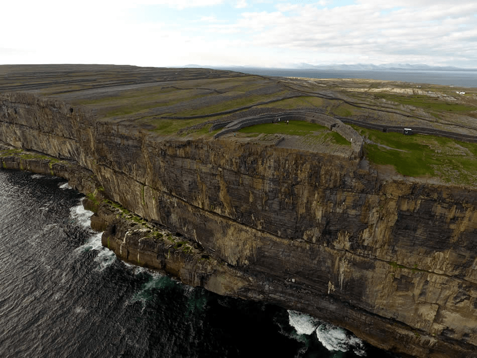 a large waterfall over a body of water