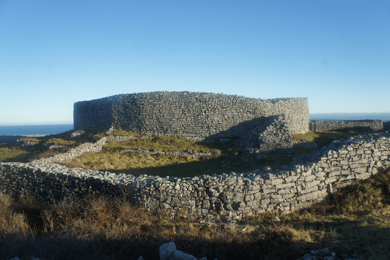 a castle on top of a rock wall