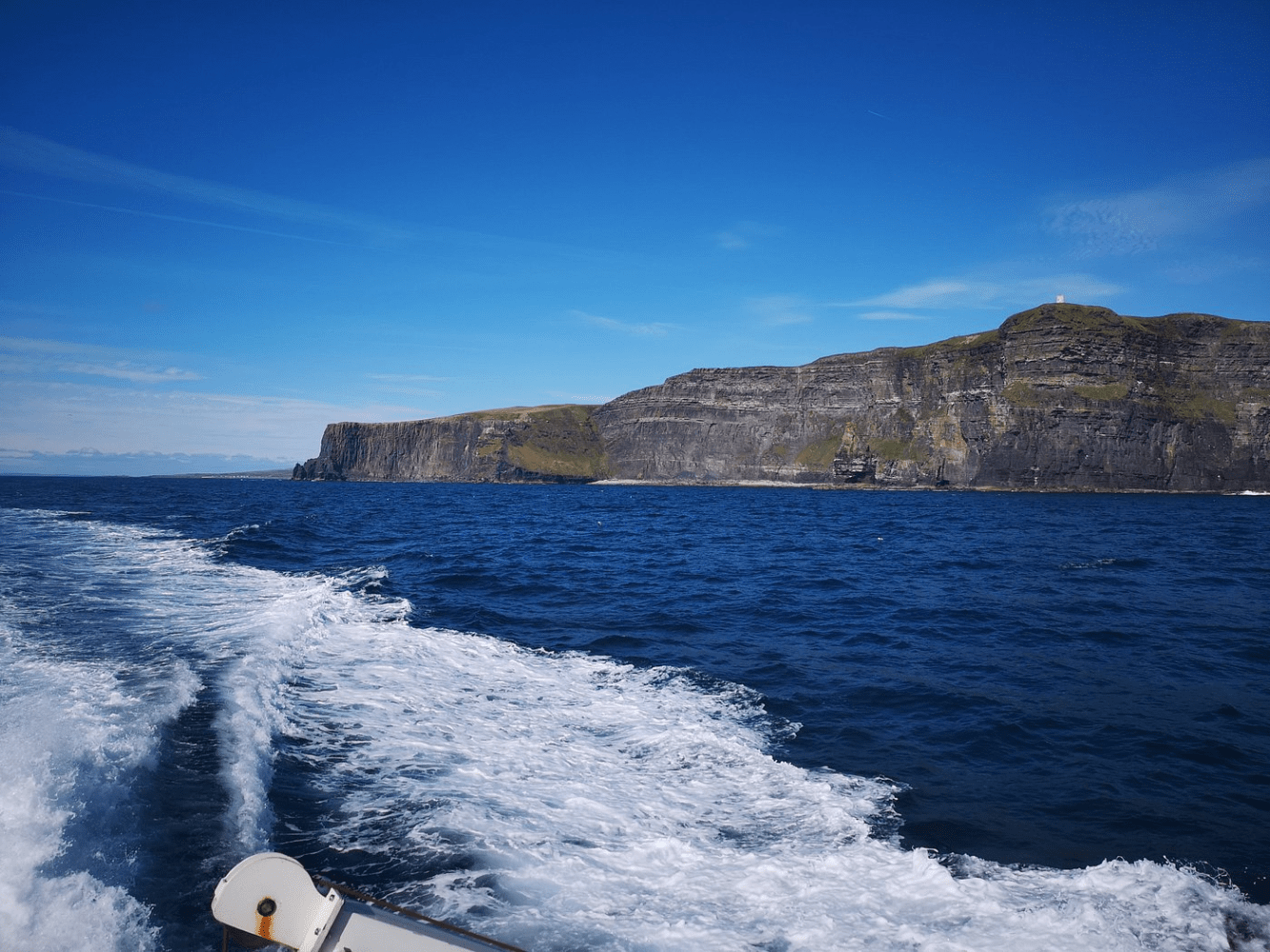 a man riding a wave on top of a body of water