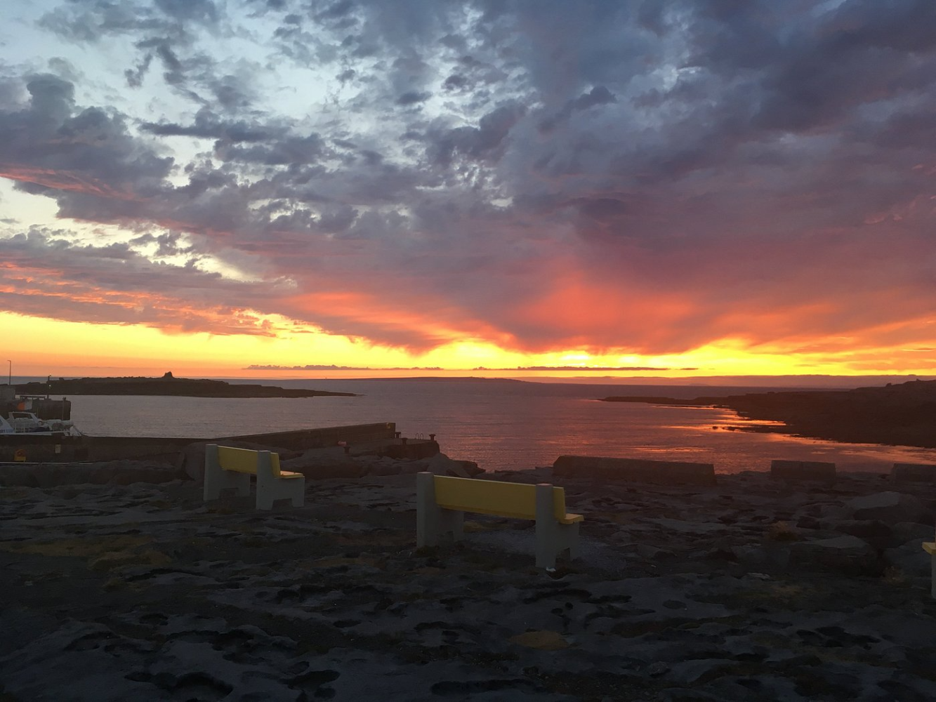 a sunset over a body of water