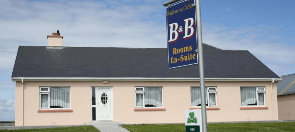 a sign in front of a house